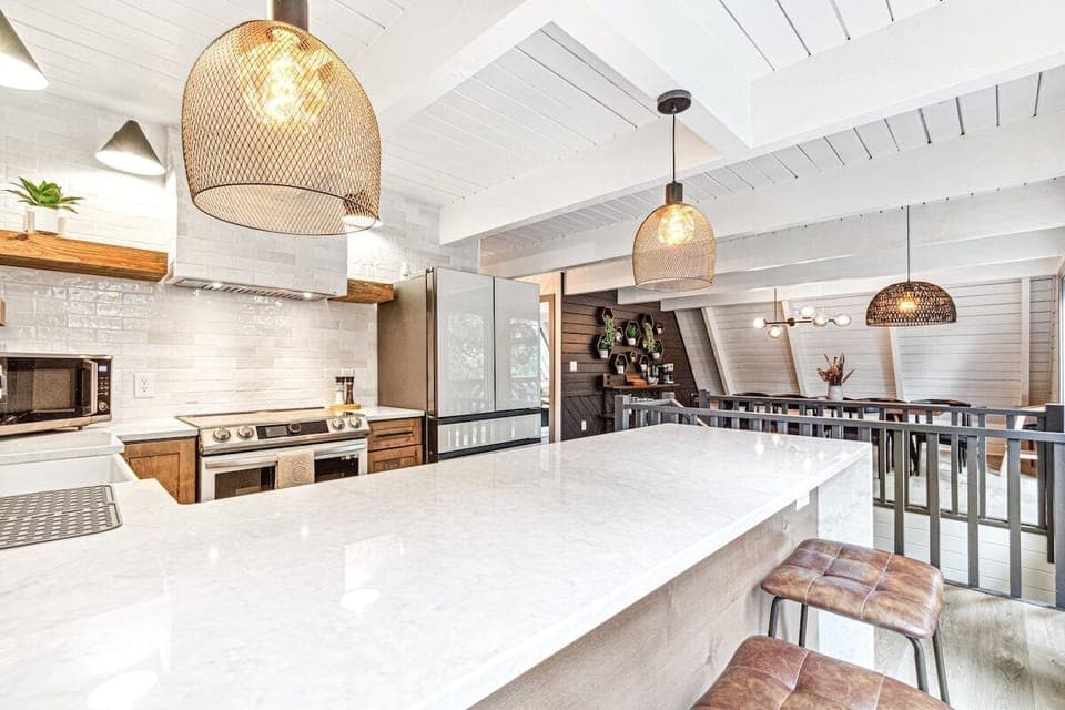 Breakfast area with couple counter stools. 