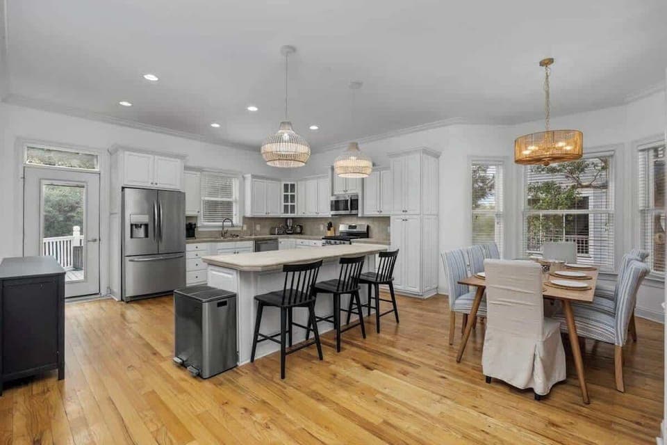 Entertain with ease in the open concept kitchen and dining area, featuring modern appliances and plenty of space for your crew to cook, eat, and relax. - The Tiara - Murrells Inlet, SC