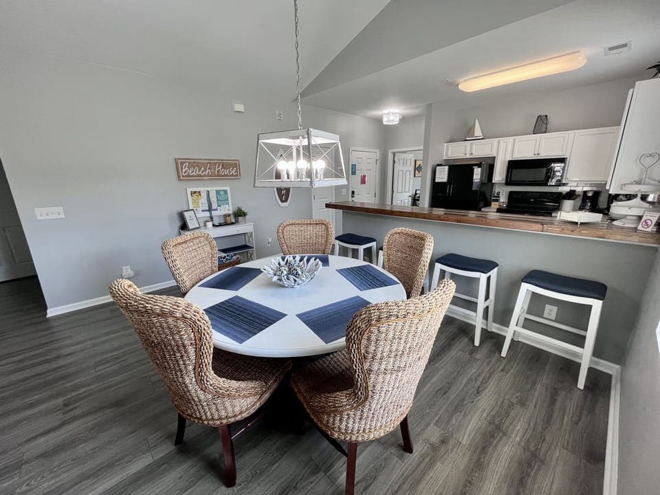 Spacious eating area for your entire crew. Table seats 6 w/ 4 bar stools at bar.