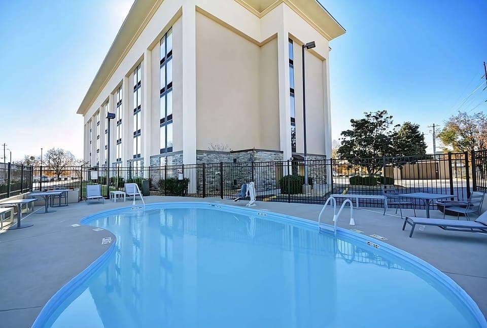 Dive into refreshing outdoor swims with sunlit loungers nearby.
