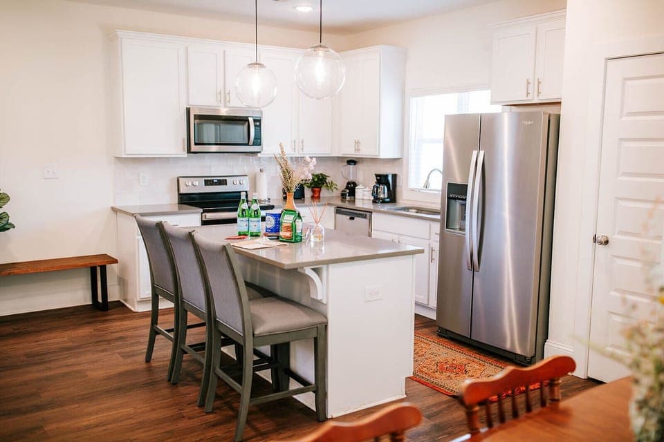 Modern appliances, plenty of space, and an open layout make meal prep a breeze.