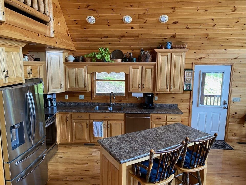 Fully stocked kitchen with all appliances.